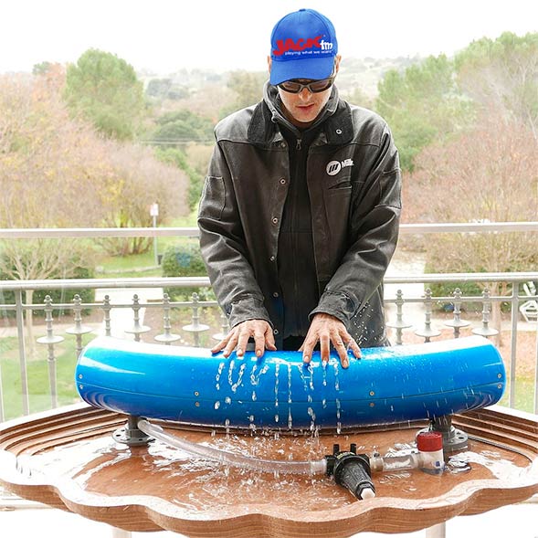 Photo of a man playing a hydraulophone
